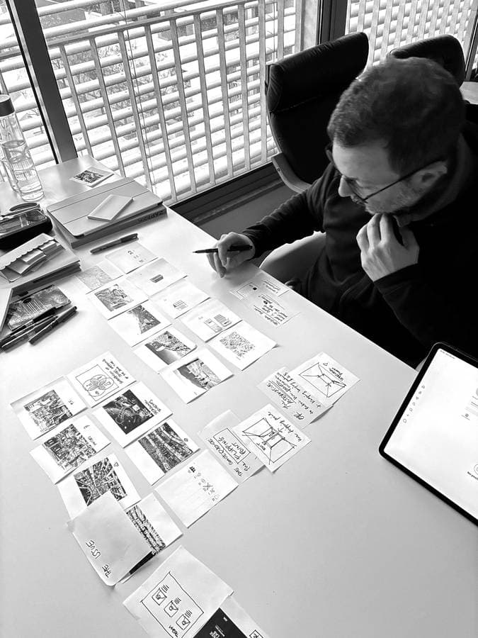 Mauro Moro sketching architectural concept ideas at his desk